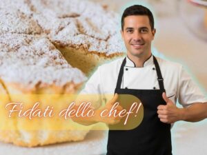 uno chef coi pollici alzati e una torta